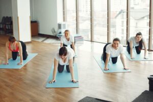 Group of women doing exercise in fitness center